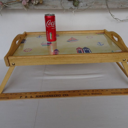 Vintage wooden breakfast tray with nautical theme used