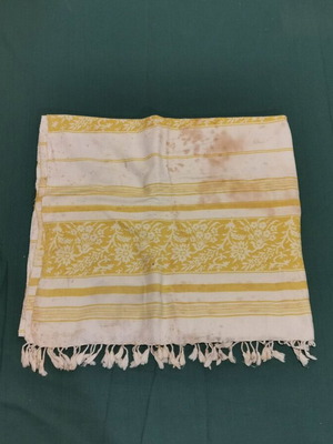 Woven bed sheet used with stain and wear from 1950 era