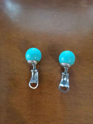 Clip earrings used, turquoise color