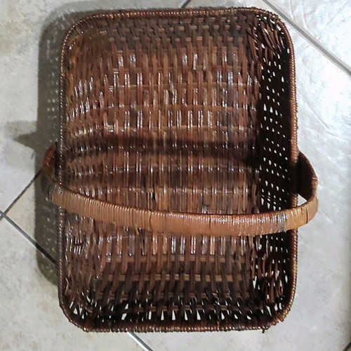 Two woven baskets in red and brown