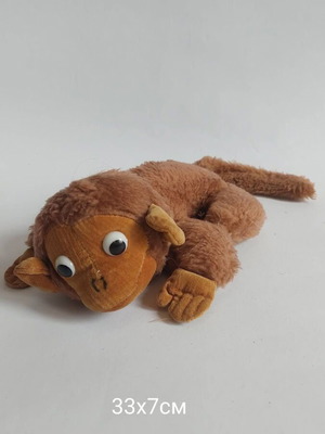 Plush monkey toy used