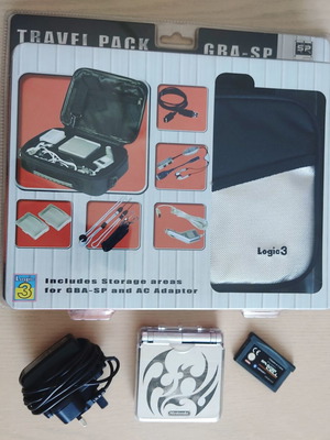 Game Boy Advance SP Tribal edition console used with extras