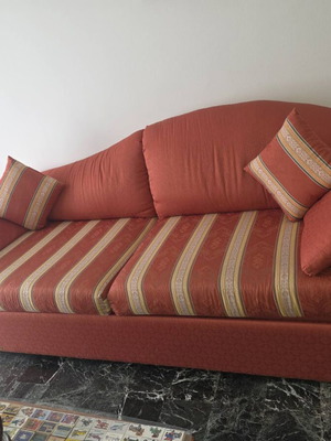 Three-seater sofa used with storage space and removable cushions