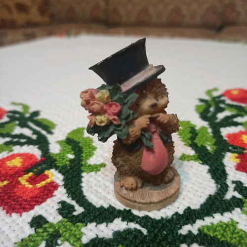 Hedgehog miniature figurine used, decorative with hat and flowers