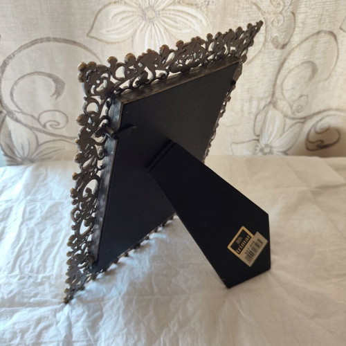 Decorative metal antique frame with baroque floral reliefs