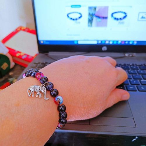 Handmade bracelet with black and pink-purple beads and metal elephant new
