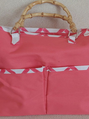 Clinique Limited Edition handbag, coral pink with white geometric pattern and bamboo handles