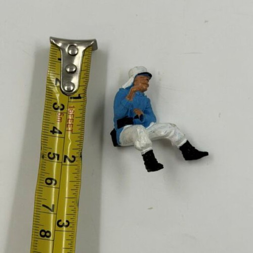 Vintage plastic soldier figure used, seated pose