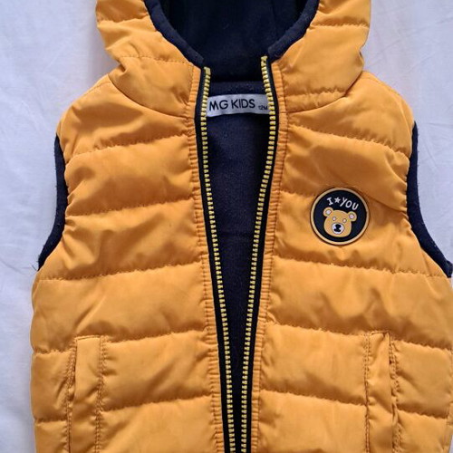 Baby sleeveless jacket used, yellow with blue lining