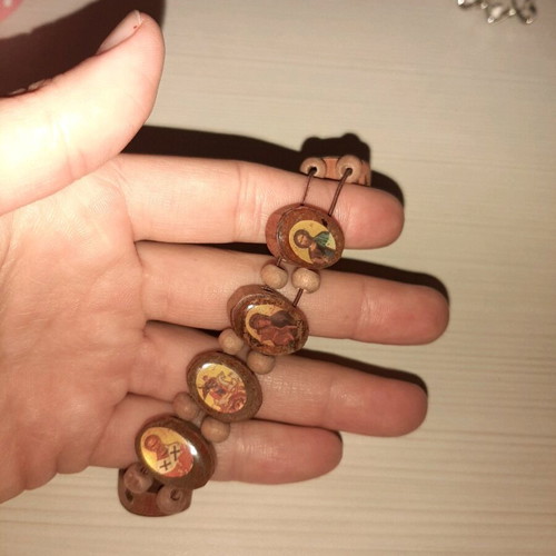 Bracelet with saint images like new with elastic cord