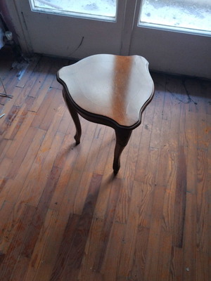 Coffee table used shield-shaped with carved legs