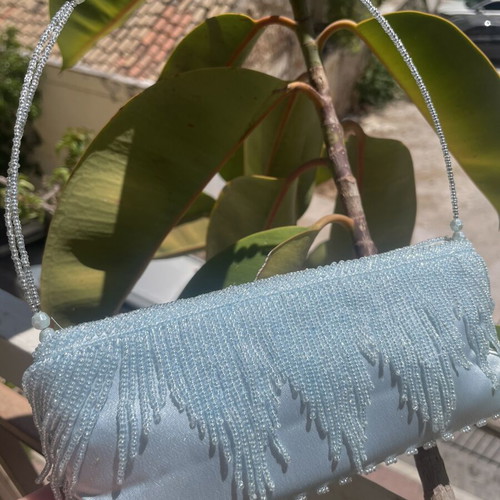 Light blue satin handbag with beads