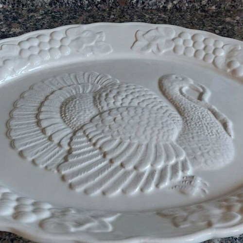 Large ceramic oval platter with embossed design like new