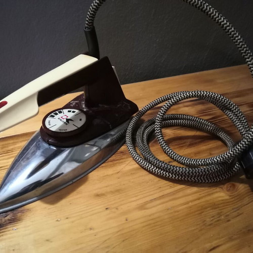 Antique electric iron used with braided cord