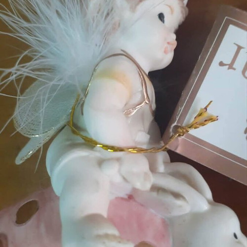 Vintage porcelain figurine Trimar baby angel on snail, like new