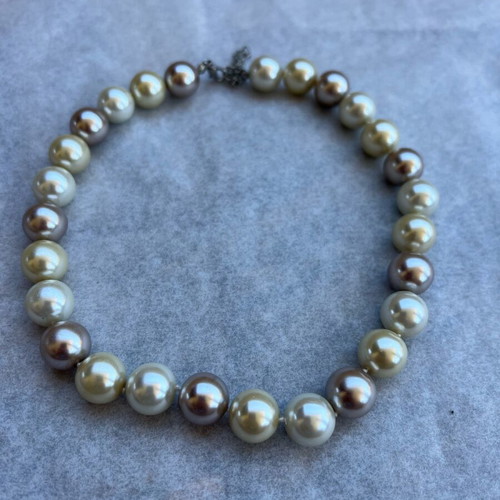 Necklace with large beads in white, gold and bronze shades like new