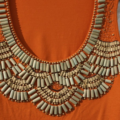 Orange sleeveless blouse with wooden beads like new, size S