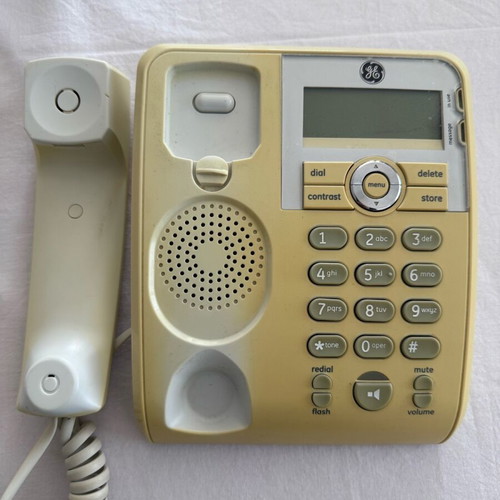 Corded phone with speakerphone used, white