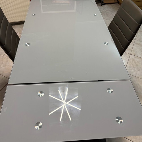 Glass extendable dining table set with 4 chairs used