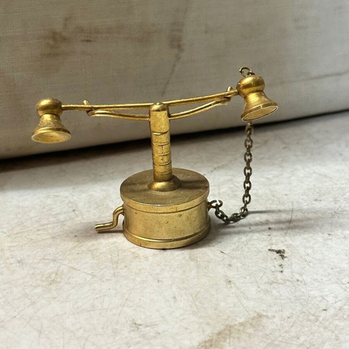 Brass miniature of old candlestick telephone, used