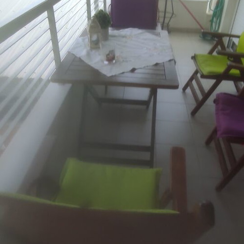 Balcony table with 4 wooden folding chairs used