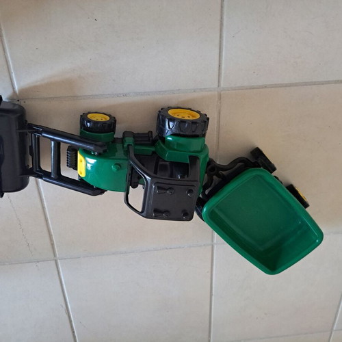 Plastic toy tractor with excavator and detachable trailer