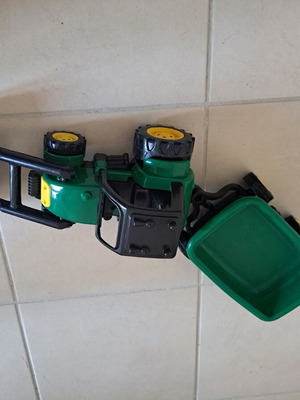 Plastic toy tractor with excavator and detachable trailer