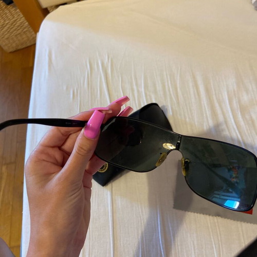 Rayban men's sunglasses used with small circular scratches