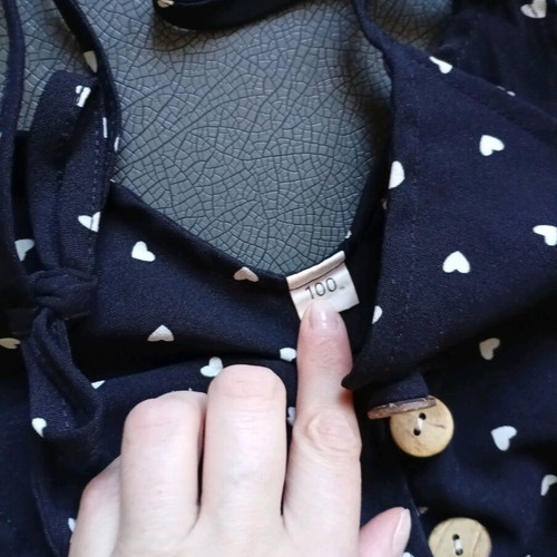Black romper with white hearts 100cm like new