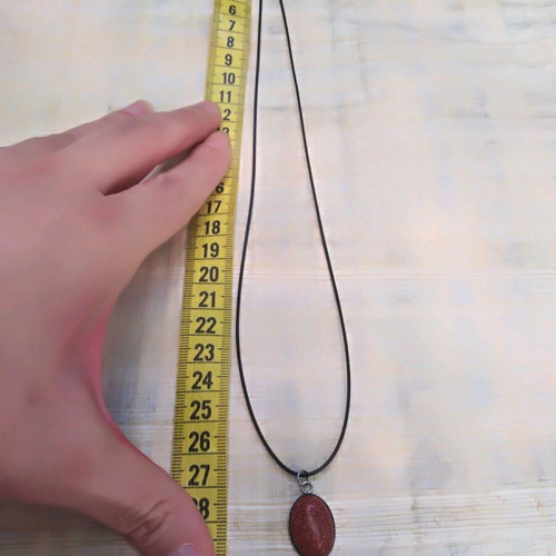 Handmade pendant with goldstone and steel cabochon new, brown