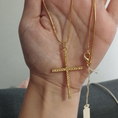 Gold-colored cross necklace with rhinestones