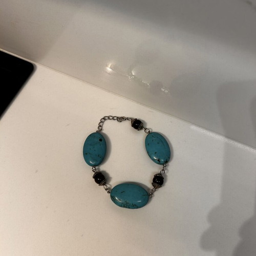 Summer bracelet with blue stones and black beads