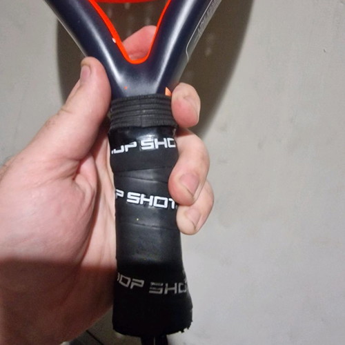 Padel racket used, moderate condition with small cracks