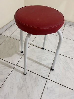 Stool with metal legs and red seat like new