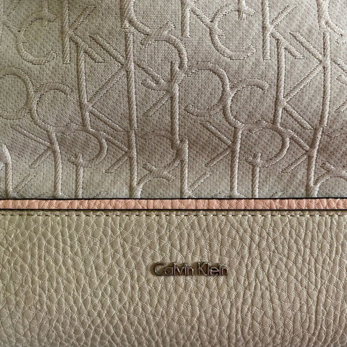 Calvin Klein crossbody bag used, beige with embossed logo