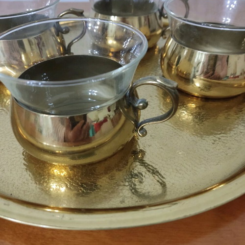 Bronze tea cups with glass on tray used