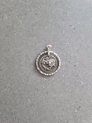 Metal pendant with Taurus zodiac sign new, silver color