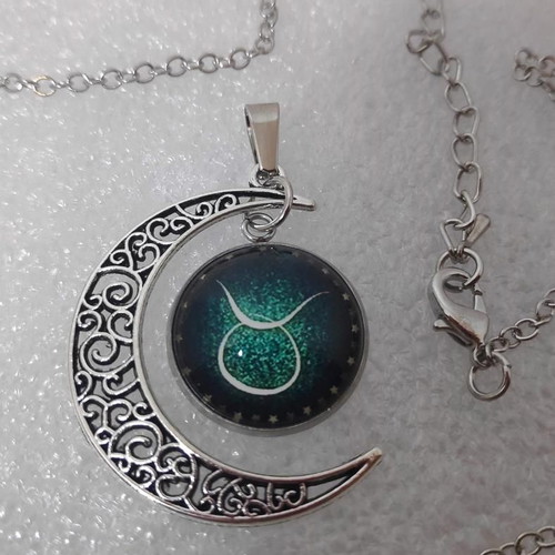 Pendant necklace with Taurus zodiac and crescent moon, like new