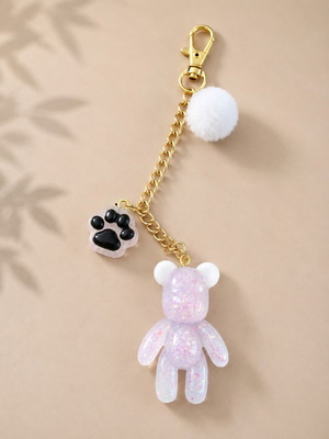 Handmade resin keychain with teddy bear and pom-pom