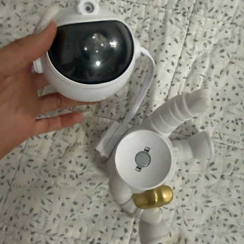 Astronaut night light with multicolor nebula projection