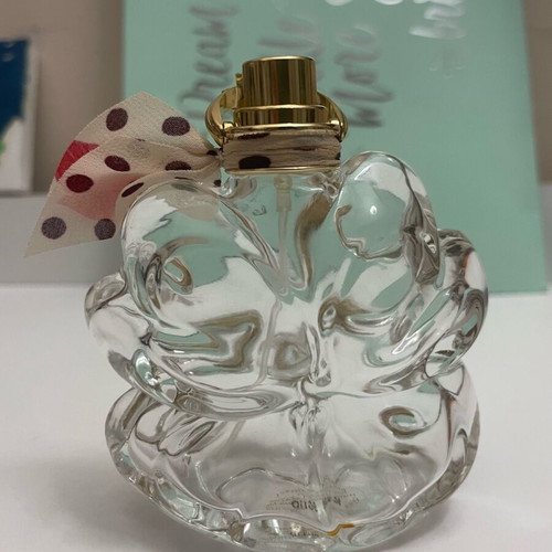 Sí Lolita Lolita Lempicka empty perfume bottle used, lucky four-leaf clover
