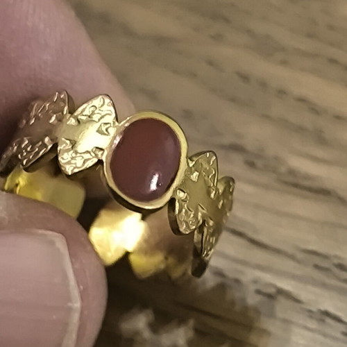 Adjustable women's gold ring with red stone and butterfly design