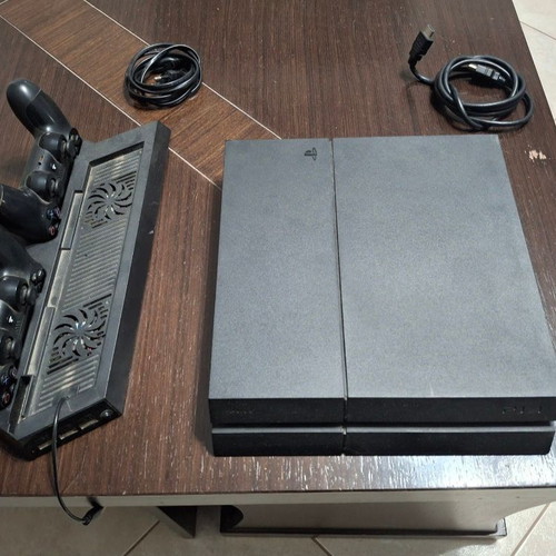 PlayStation 4 console used with 2 controllers, 11 games and cooling stand