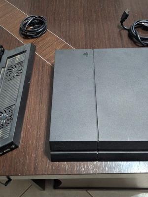 PlayStation 4 console used with 2 controllers, 11 games and cooling stand