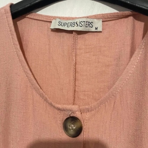 Women's one-piece jumpsuit new, salmon color with wooden buttons, size M