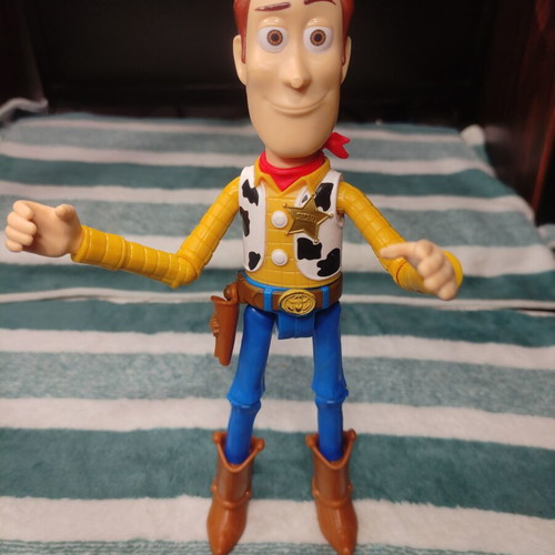 Woody action figure from Toy Story 23cm used, missing hat and nose damage