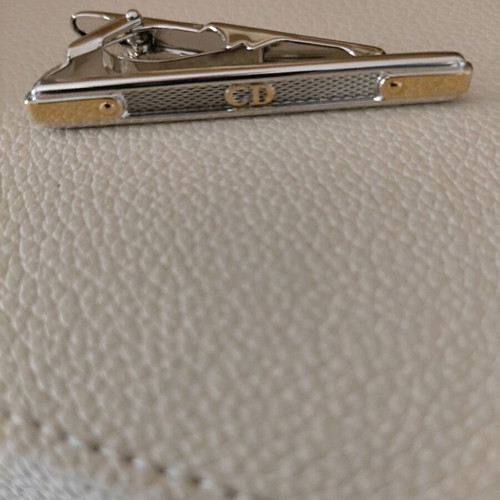 Authentic Dior tie pin new, silver with gold details