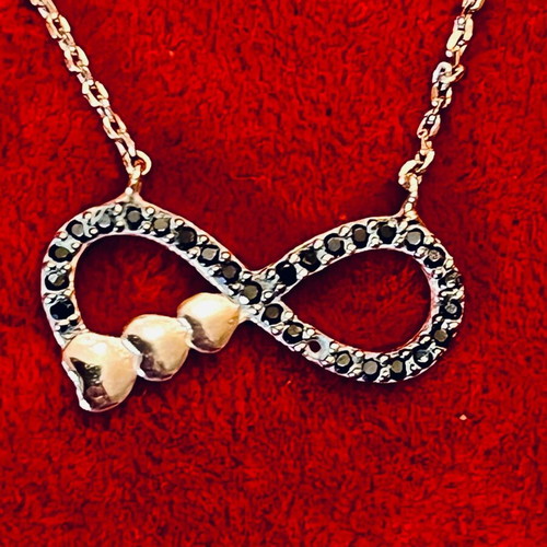 Silver 925 necklace with gold vermeil coating, infinity design with gold hearts, used