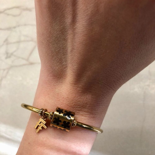 Folli Follie gold bracelet bangle with black enamel charm like new
