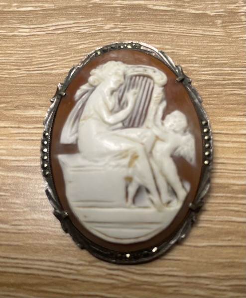 Vintage shell cameo brooch, Greek muse with harp and cupid figure, Silver frame